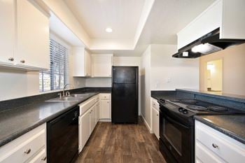 Kitchens include: refrigerator, dishwasher, stove, range, and garbage disposal